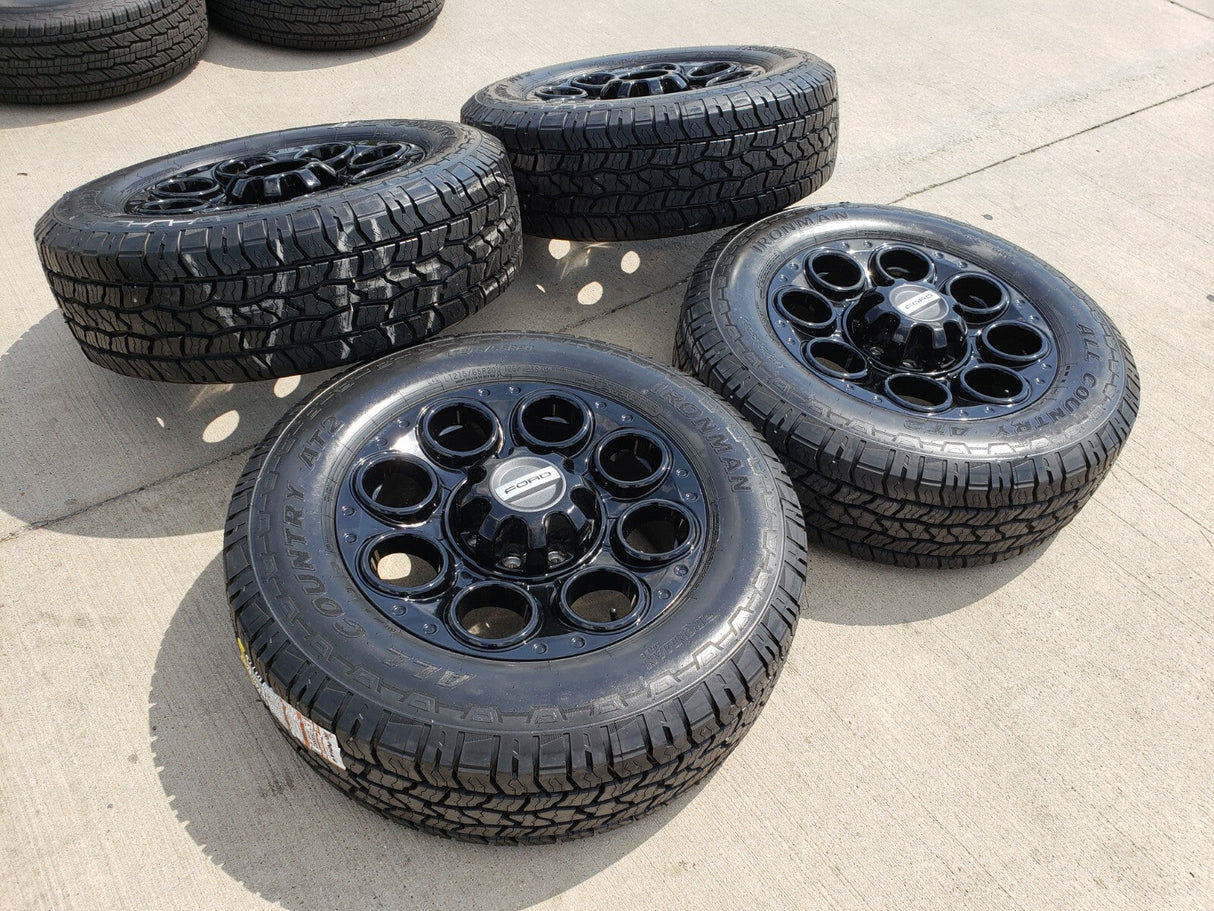 20" Ford F-250 F-350 OEM black TREMOR wheels rims 10299 10484 A/T2 tires NEW Texas Truck Tire
