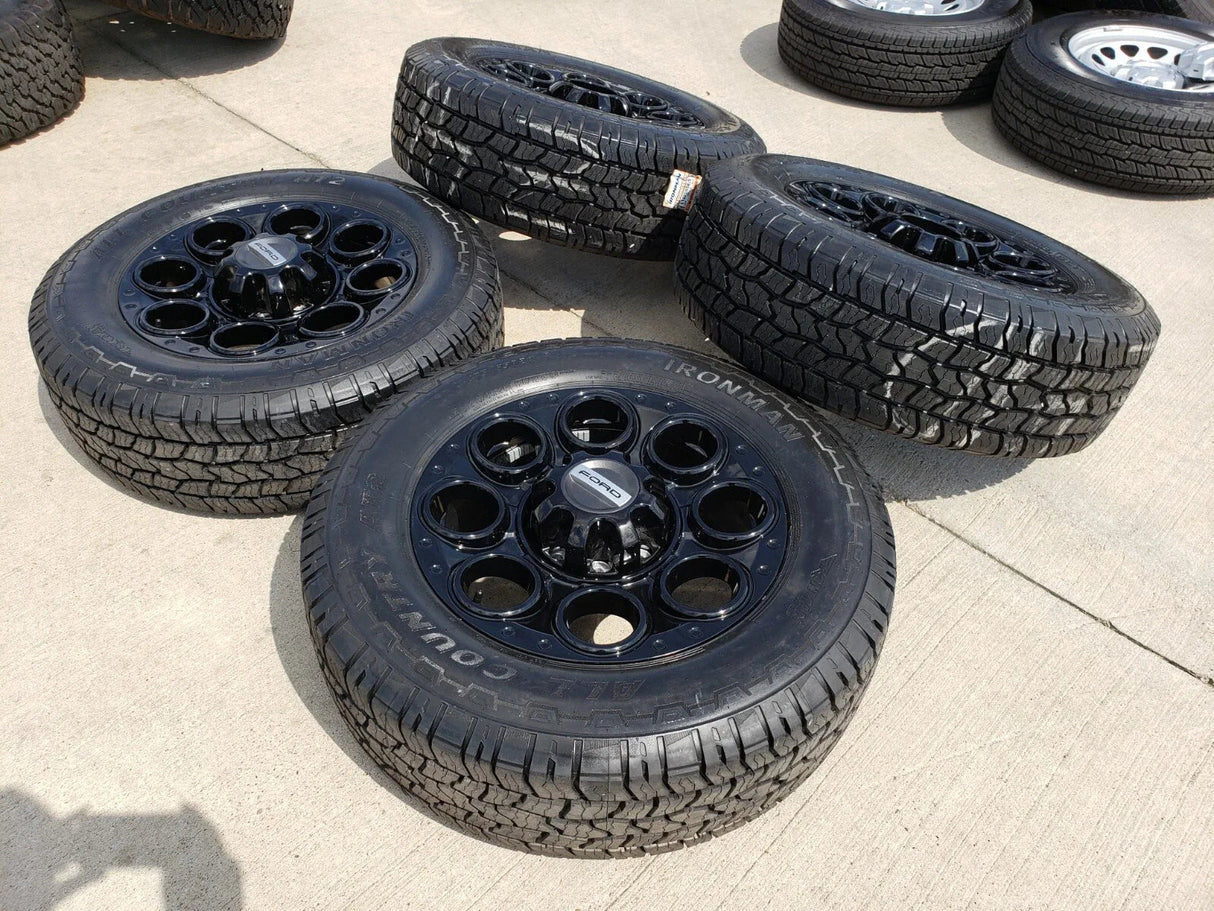 20" Ford F-250 F-350 OEM black TREMOR wheels rims 10299 10484 A/T2 tires NEW Texas Truck Tire