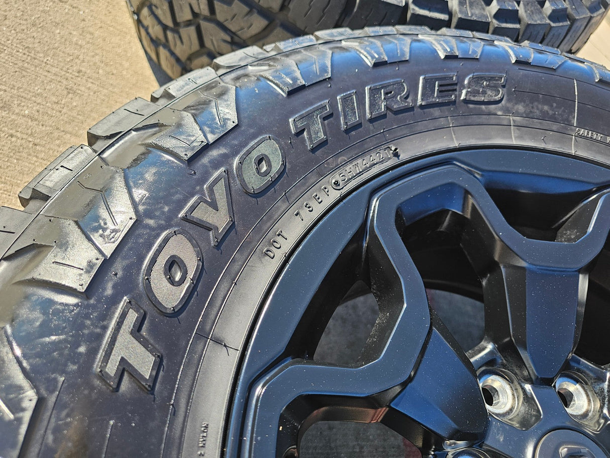 18" Dodge Ram 1500 TRX RHO Black OEM 66002 wheels rims TOYO A/T3 35" Texas Truck Tire