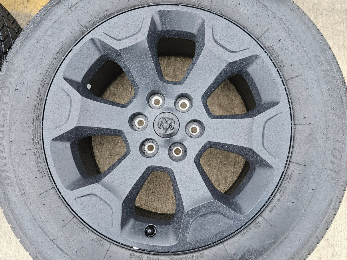 20" Dodge Ram 1500 OEM Laramie Black 2680 wheels rims 2024 2025 2026 BRIDGESTONE Texas Truck Tire