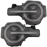Ford Bronco 21-26 LED Projector Headlights w/ Ultra High Power LED High/Low Beams & White OLED DRL w/ Start-Up Lighting Sequence & Scanning Amber LED Turn Signals - Smoked / Black