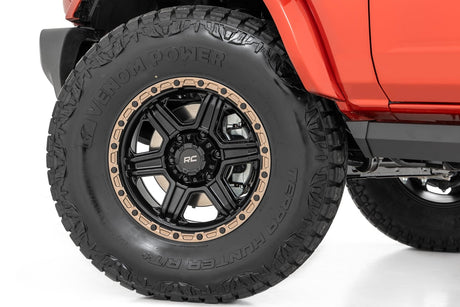 79 Series Wheel One-Piece Semi Gloss Black w/Bronze Ring 18x9 6x5.5 0mm Rough Country