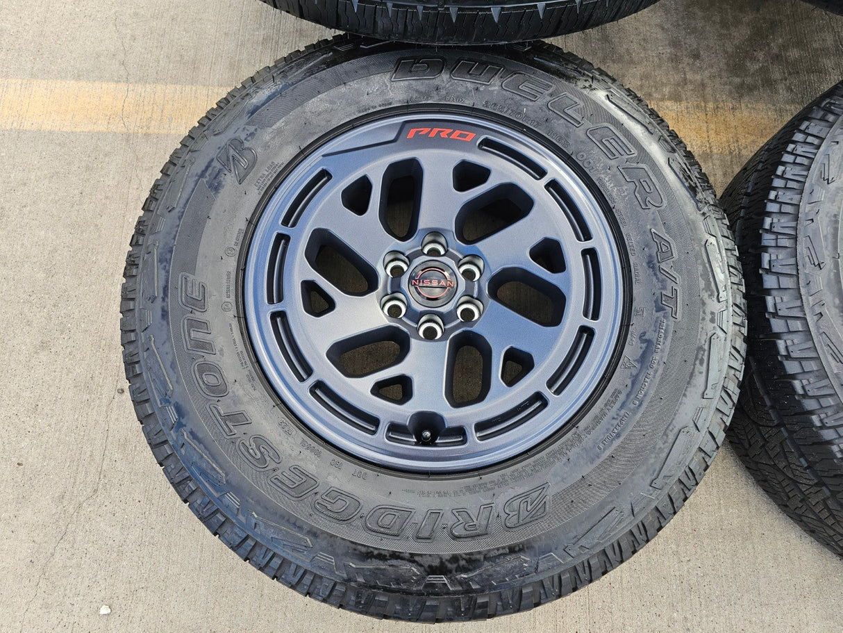 17" Nissan Frontier X-PRO OEM Desert Runner wheels rims tires DUELER A/T Texas Truck Tire