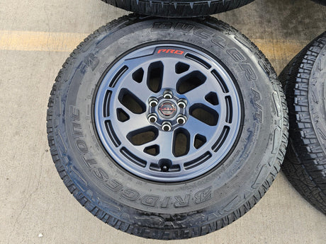 17" Nissan Frontier X-PRO OEM Desert Runner wheels rims tires DUELER A/T Texas Truck Tire