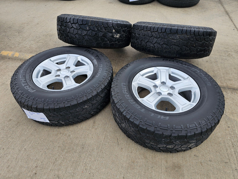 17" Jeep Wrangler Rubicon OEM wheels rims 9216 Gladiator tires A/T Texas Truck Tire