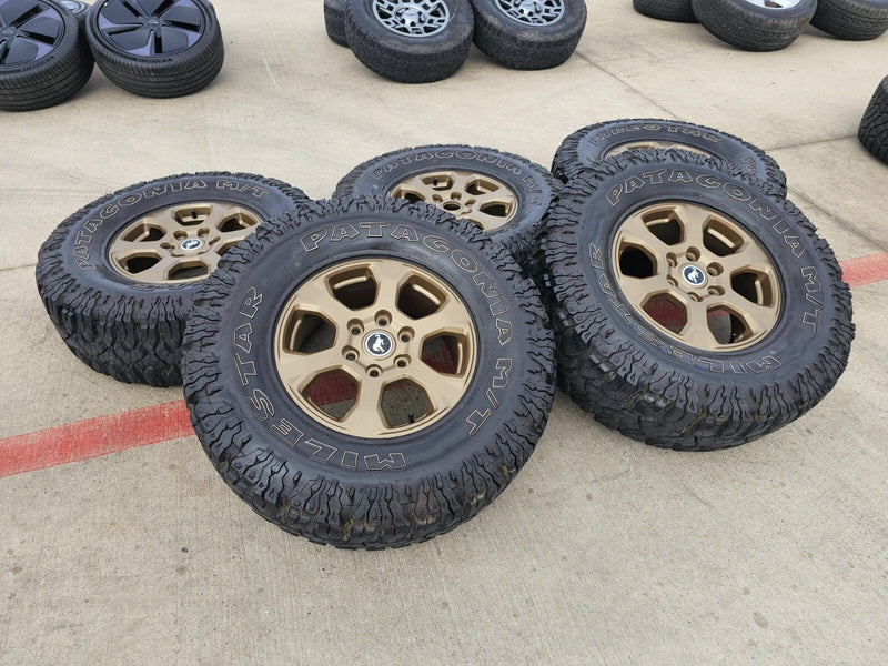 17" Ford Bronco 10384 OEM wheels rims BRONZE tires Ranger 35" M/T Texas Truck Tire