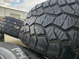 17" Jeep Wrangler Rubicon OEM wheels rims 9216 Gladiator tires A/T Texas Truck Tire