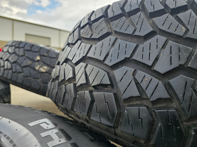17" Jeep Wrangler Rubicon OEM wheels rims 9216 Gladiator tires A/T Texas Truck Tire