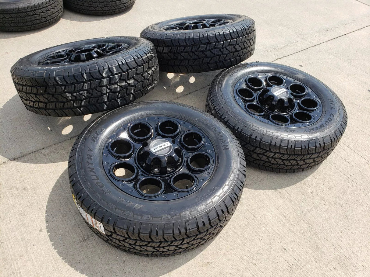 20" Ford F-250 F-350 OEM black TREMOR wheels rims 10299 10484 A/T2 tires NEW Texas Truck Tire