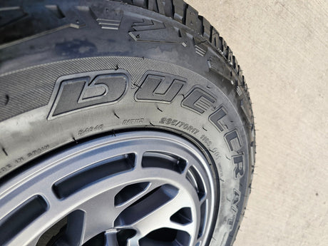17" Nissan Frontier X-PRO OEM Desert Runner wheels rims tires DUELER A/T Texas Truck Tire