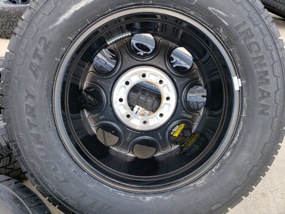20" Ford F-250 F-350 OEM black TREMOR wheels rims 10299 10484 A/T2 tires NEW Texas Truck Tire