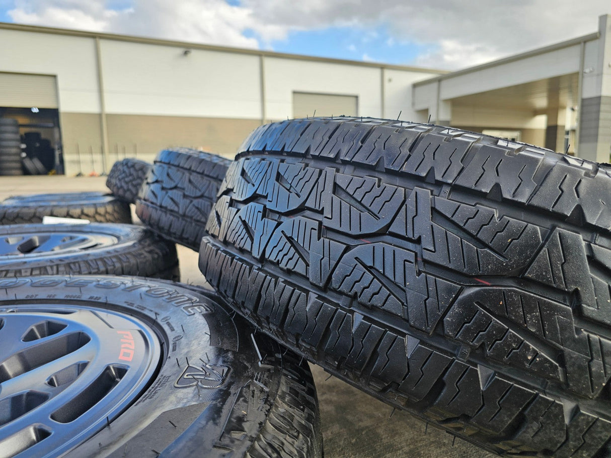 17" Nissan Frontier X-PRO OEM Desert Runner wheels rims tires DUELER A/T Texas Truck Tire