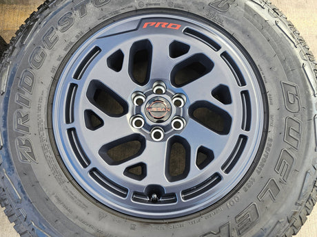 17" Nissan Frontier X-PRO OEM Desert Runner wheels rims tires DUELER A/T Texas Truck Tire