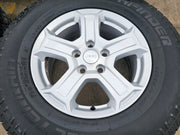 17" Jeep Wrangler Rubicon OEM wheels rims 9216 Gladiator tires A/T Texas Truck Tire