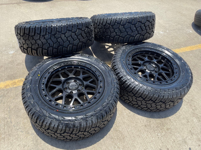 20x9 20" KMC KM549 Ford Expedition F-150 6x135 wheels rims tires 33" NEW Texas Truck Tire