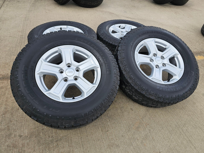 17" Jeep Wrangler Rubicon OEM wheels rims 9216 Gladiator tires A/T Texas Truck Tire