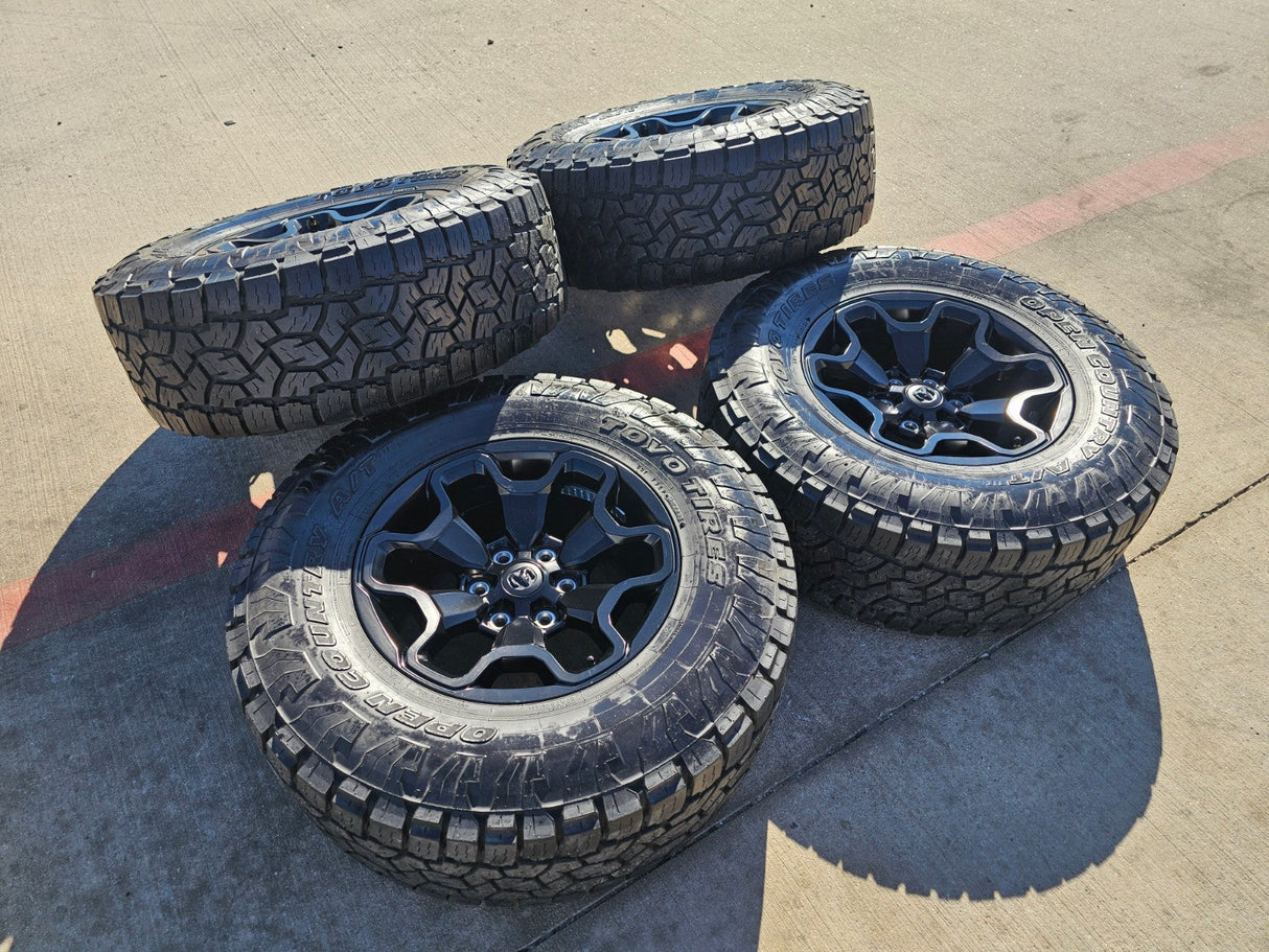 18" Dodge Ram 1500 TRX RHO Black OEM 66002 wheels rims TOYO A/T3 35" Texas Truck Tire