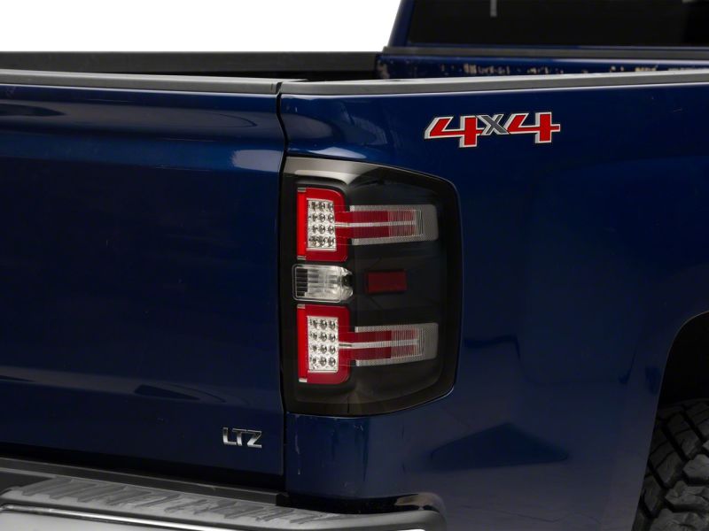 Raxiom 14-18 Chevrolet Silverado 1500 LED Taillights w/ SEQL Turn Signals- Blk Housing (Clear Lens)