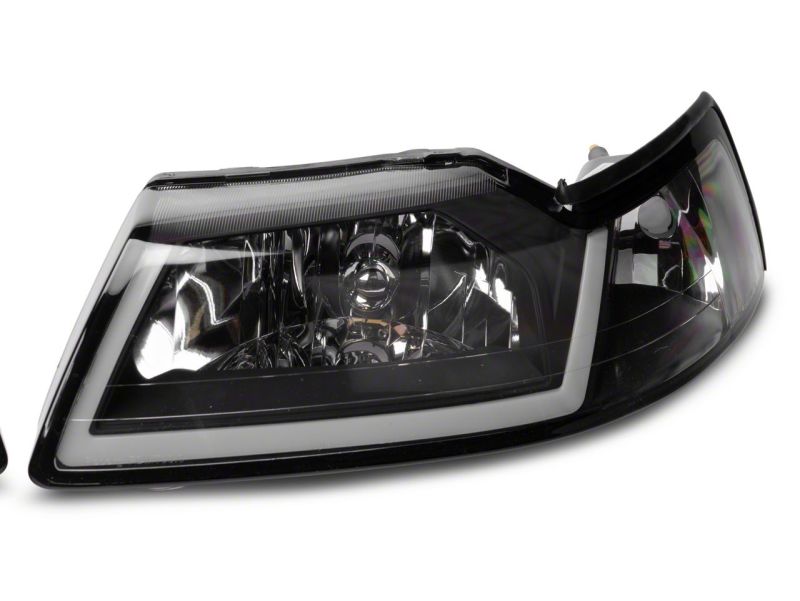 Raxiom 99-04 Ford Mustang Axial Series Headlights w/ LED Bar- Blk Housing (Clear Lens)