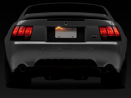 Raxiom 99-04 Ford Mustang Excluding 99-01 Cobra Tail Lights- Black Housing (Smoked Lens)