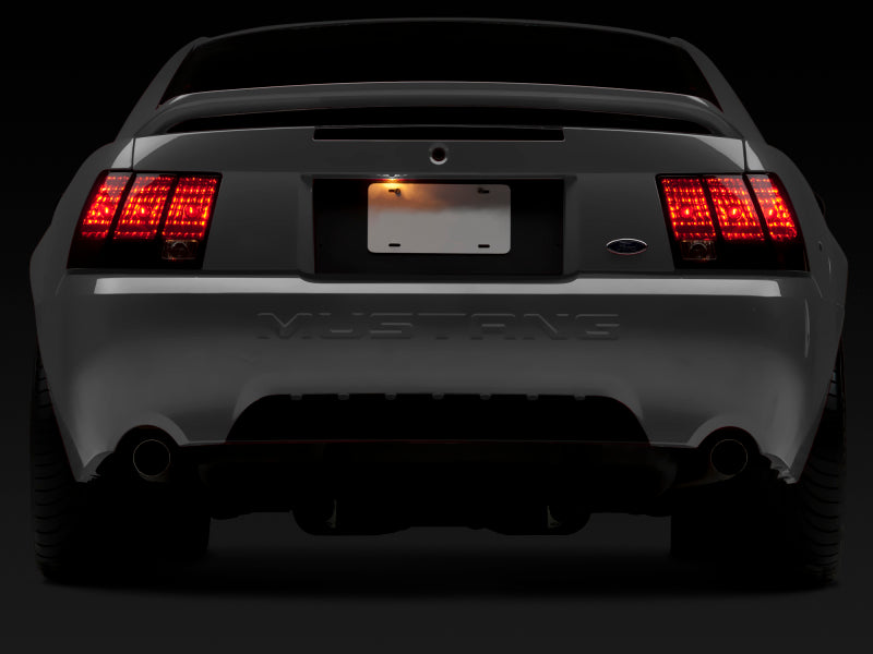 Raxiom 99-04 Ford Mustang Excluding 99-01 Cobra Tail Lights- Black Housing (Smoked Lens)