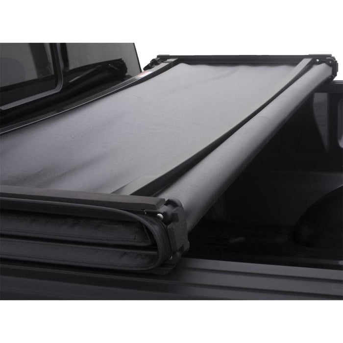 Lund 04-14 Ford F-150 (5.5ft. Bed) Genesis Tri-Fold Tonneau Cover - Black