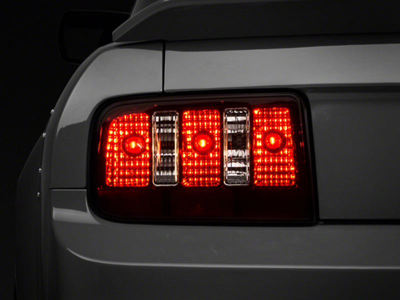 Raxiom 05-09 Ford Mustang Coyote Tail Lights- Blk Housing (Smoked Lens)