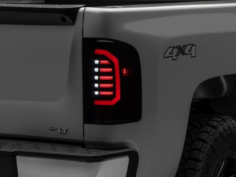 Raxiom 07-14 Chevrolet Silverado 1500 Axial Series LED Tail Lights- Blk Housing (Smoked Lens)