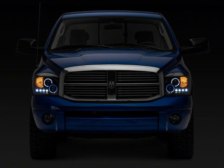 Raxiom 06-08 Dodge RAM 1500 LED Halo Projector Headlights- Blk Housing (Clear Lens)