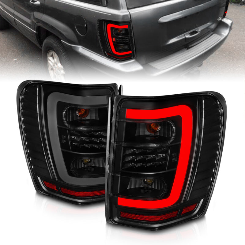 ANZO 1999-2004 Jeep Grand Cherokee LED Tail Lights w/ Light Bar Black Housing Smoke Lens