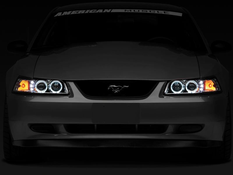 Raxiom 99-04 Ford Mustang Dual LED Halo Projector Headlights- Chrome Housing (Clear Lens)