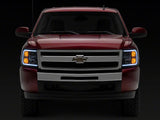 Raxiom 07-13 Chevrolet Silverado 1500 Axial Headlights w/ SEQL LED Bar- Blk Housing (Clear Lens)