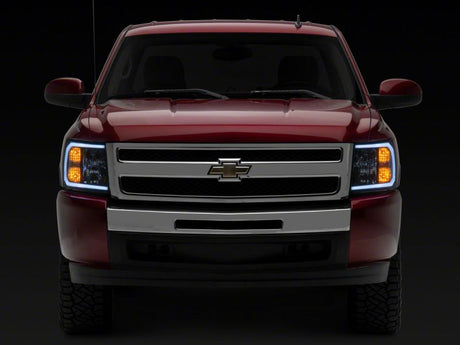 Raxiom 07-13 Chevrolet Silverado 1500 Axial Headlights w/ SEQL LED Bar- Blk Housing (Clear Lens)