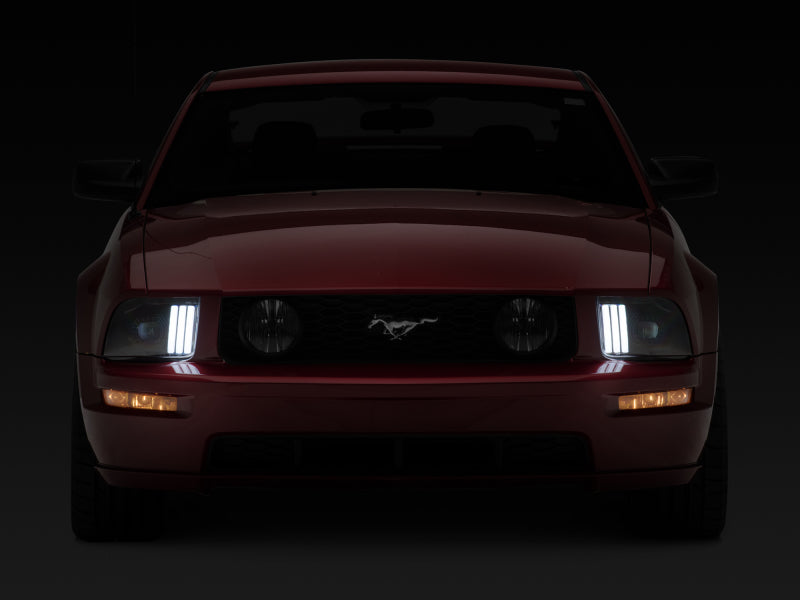 Raxiom 05-09 Ford Mustang w/ Halogen Prjctor Headlights- Black Housing (Clear Lens) (No GT500 )