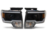 Raxiom 09-14 Ford F-150 Axial Series Projector Headlights w/ LED Light Bar- Blk Housing (Clear Lens)