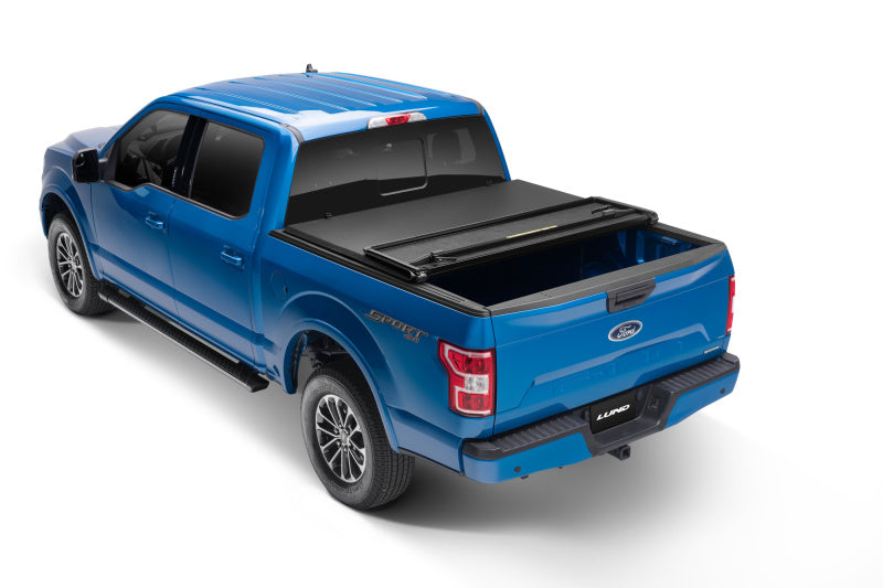 Lund 09-14 Ford F-150 Styleside (6.5ft. Bed) Hard Fold Tonneau Cover - Black